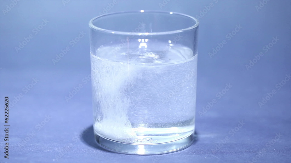 Tablet of sparkling aspirin in glass Tablet of sparkling aspirin in glass