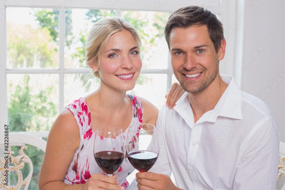 Loving couple with wine glasses at home Loving couple with wine glasses at home