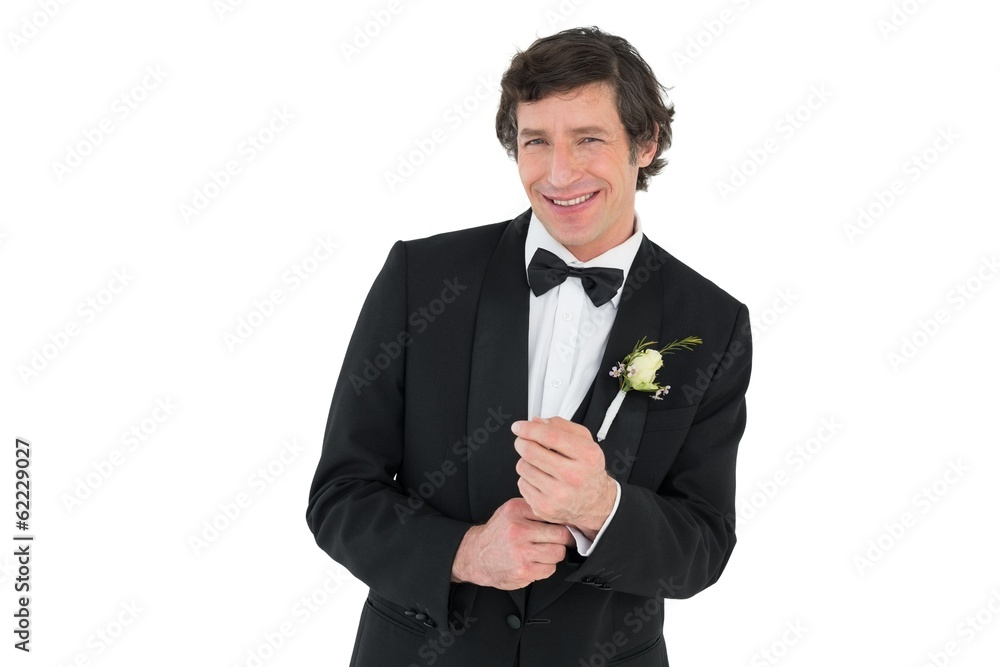 Man adjusting cuff links before wedding Man adjusting cuff links before wedding