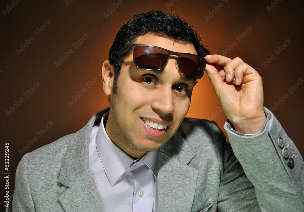 Fototapeta premium Young businessman smiling with stupid face