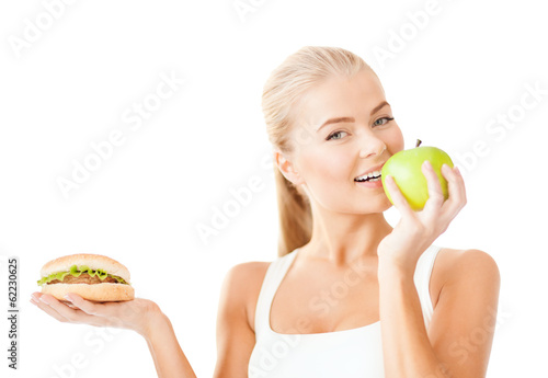 smiling woman with apple and hamburger