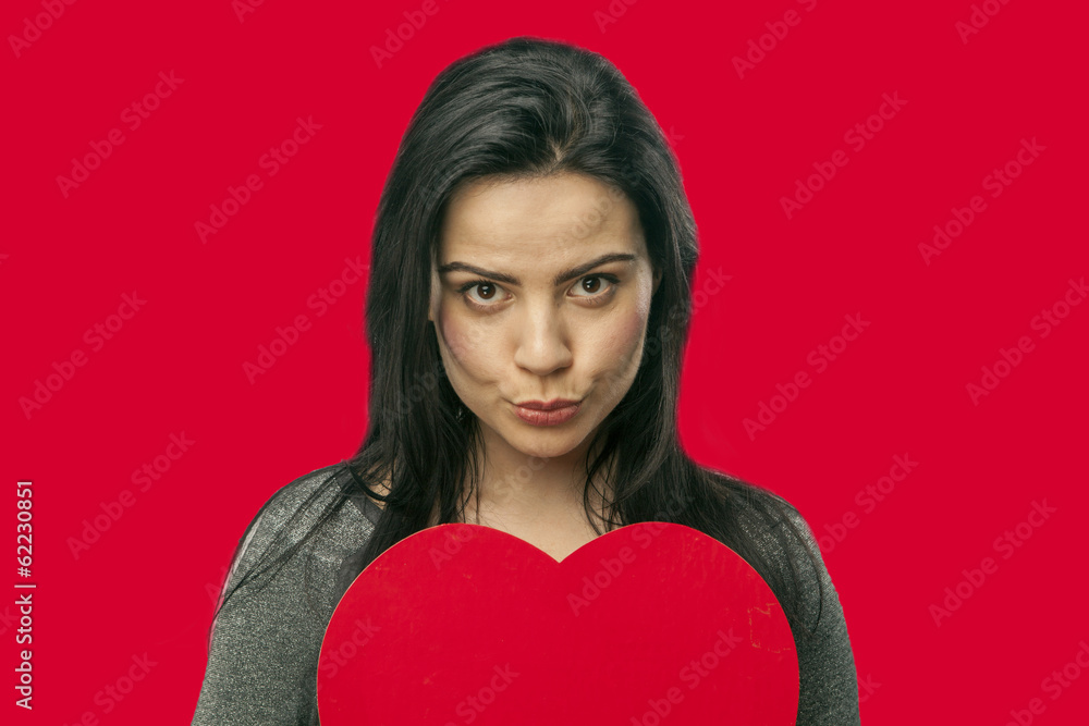 girl holding a heart in her hands girl holding a heart in her hands