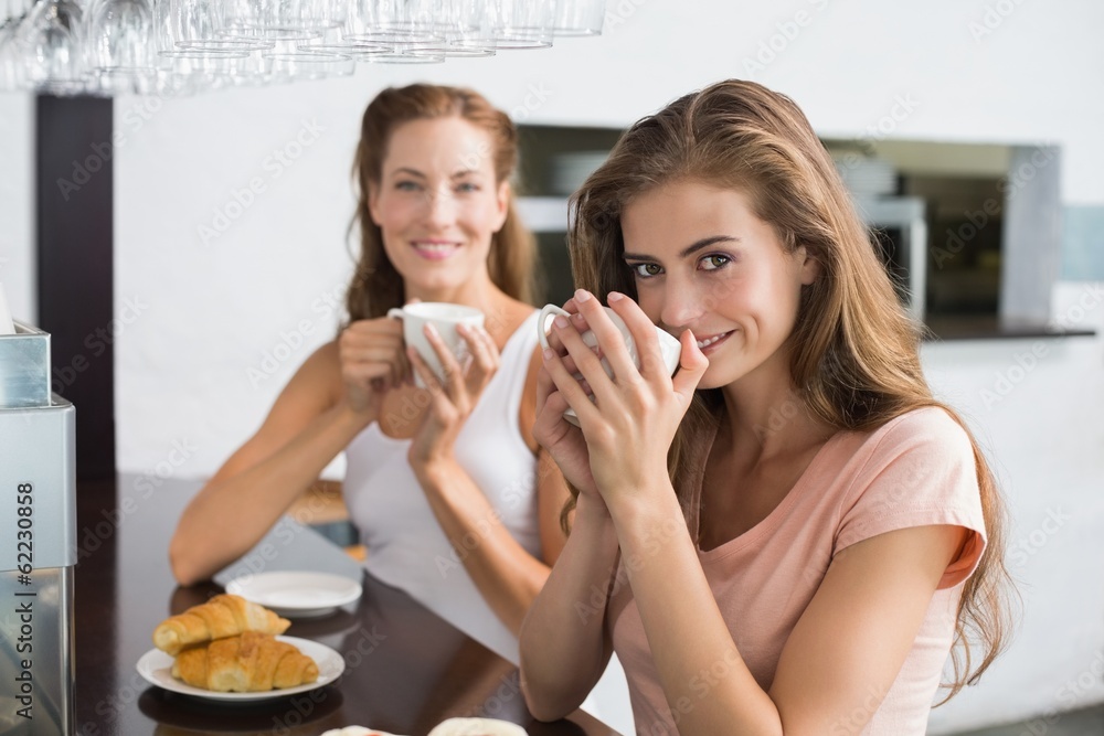Female friends having coffee at coffee shop Female friends having coffee at coffee shop