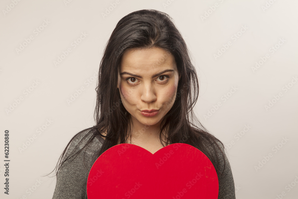 girl holding a heart in her hands girl holding a heart in her hands