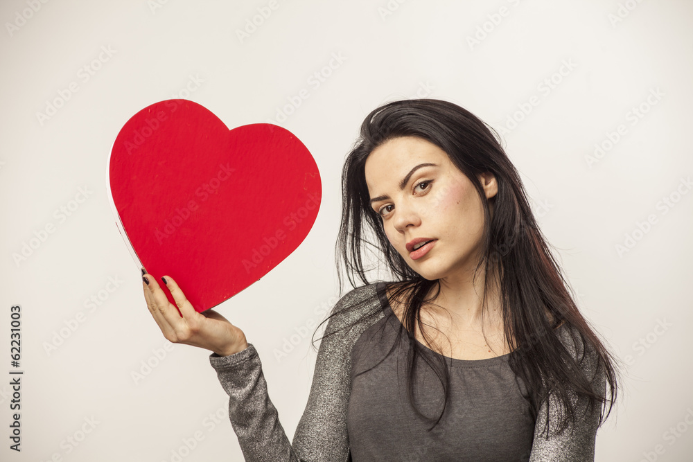 girl holding a heart in her hands girl holding a heart in her hands
