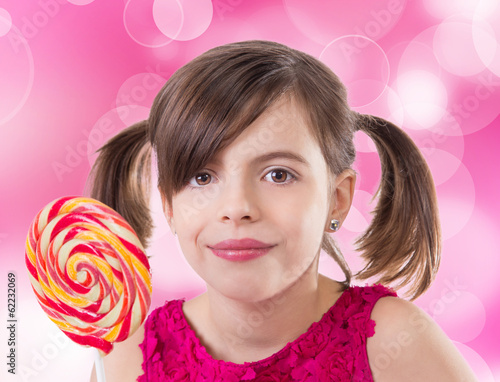 Little cute girl with lollipop