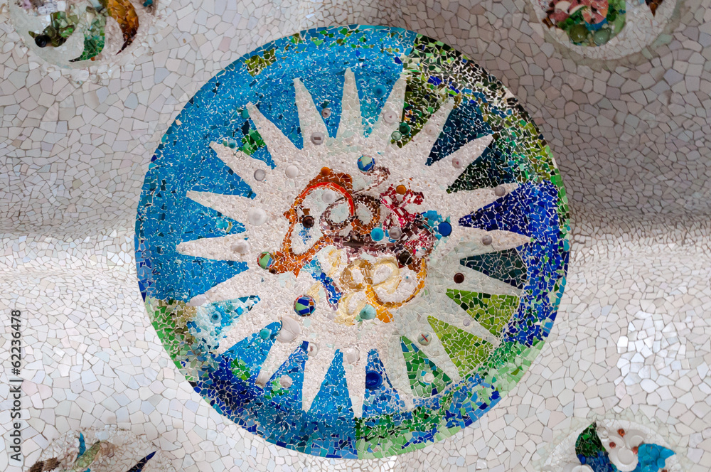 Fototapeta premium Season mosaic with white sun at sala Hipostila in Park Guell at
