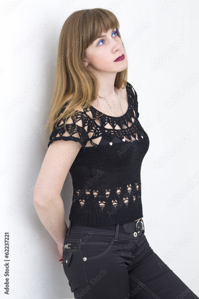 Young beautiful woman in a lacy dress