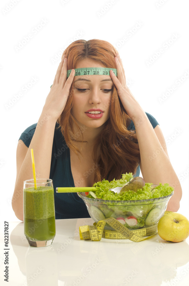 Woman with a centimeter on her head thinking on dieting Woman with a centimeter on her head thinking on dieting