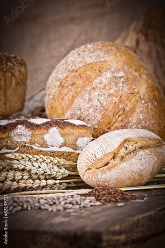 fresh bread and wheat on the wooden 