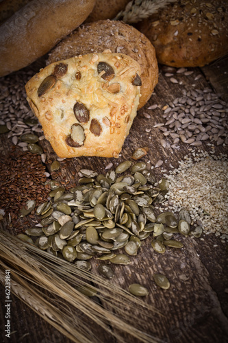 fresh bread and wheat on the wooden - rustic