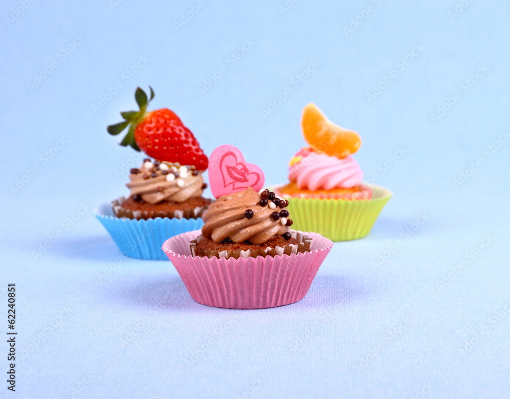 Appetizing cupcakes with kiss heart, tangerine, strawberry Appetizing cupcakes with kiss heart, tangerine, strawberry