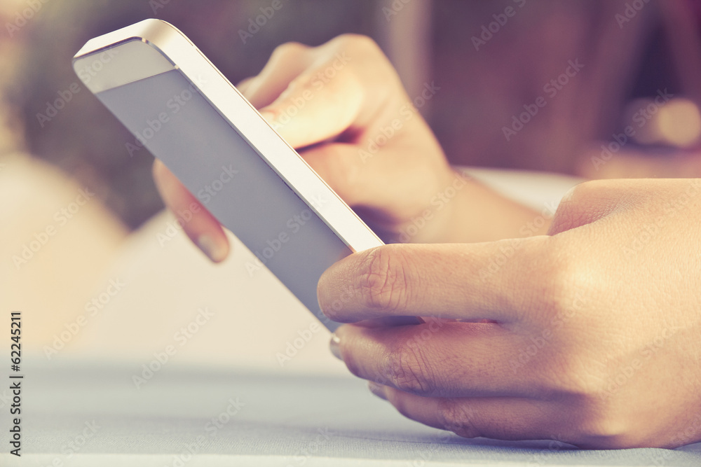 Teenage girl text messaging on her phone Teenage girl text messaging on her phone