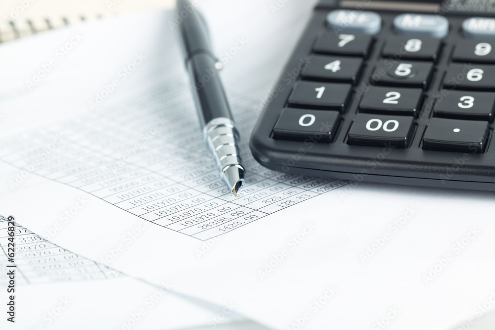 calculator and pen with financial documents calculator and pen with financial documents