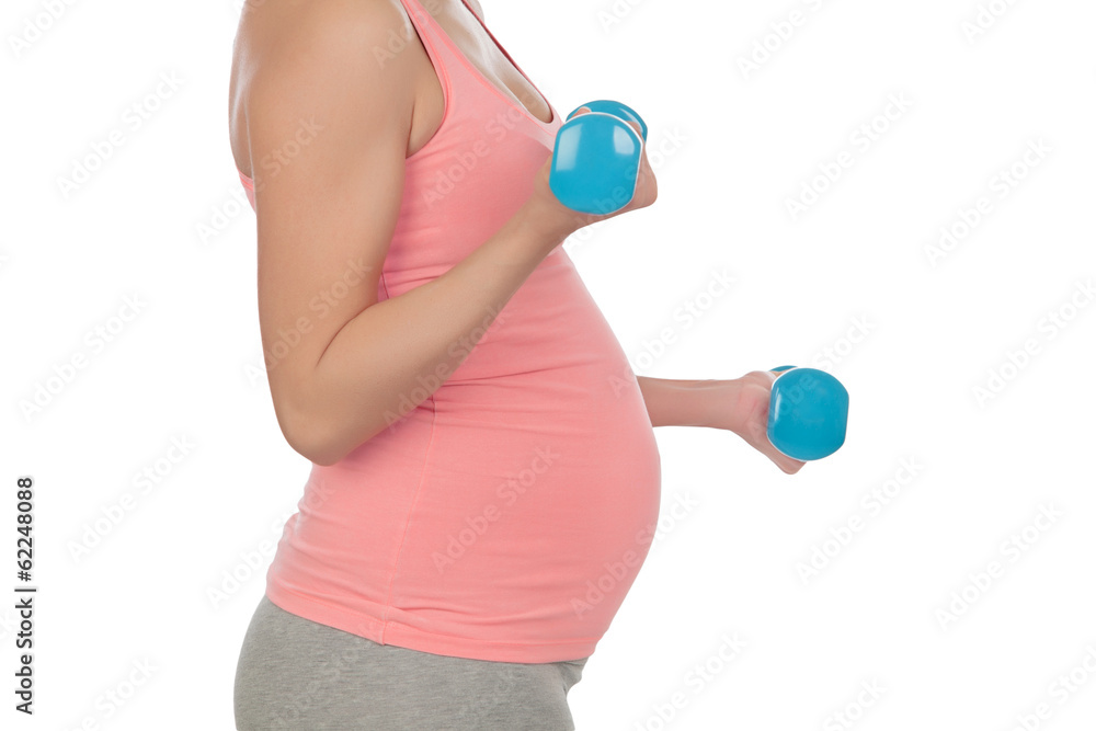 Pregnant woman doing exercise with dumbbells Pregnant woman doing exercise with dumbbells