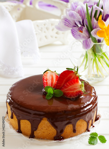 Sponge cake with chocolate cream and strawberries.