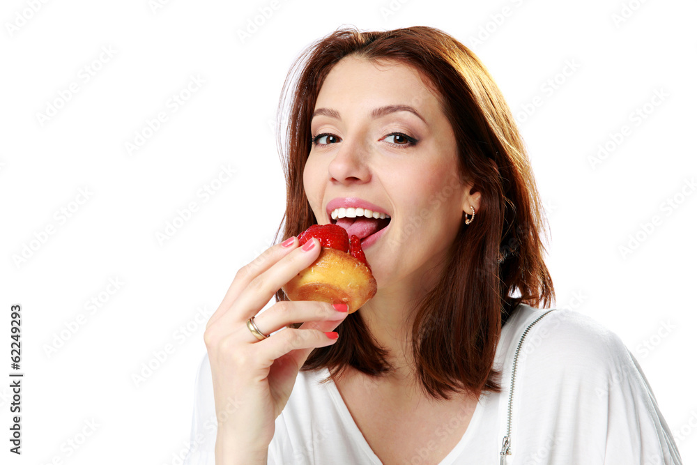 woman eating fresh strawberry cake
