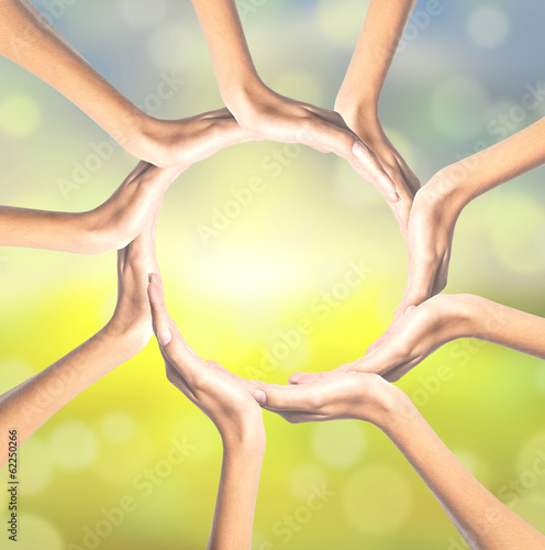 Human hands making circle on bright background