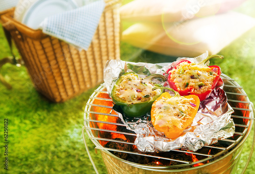 Photos Stuffed savory sweet peppers grilling on foil