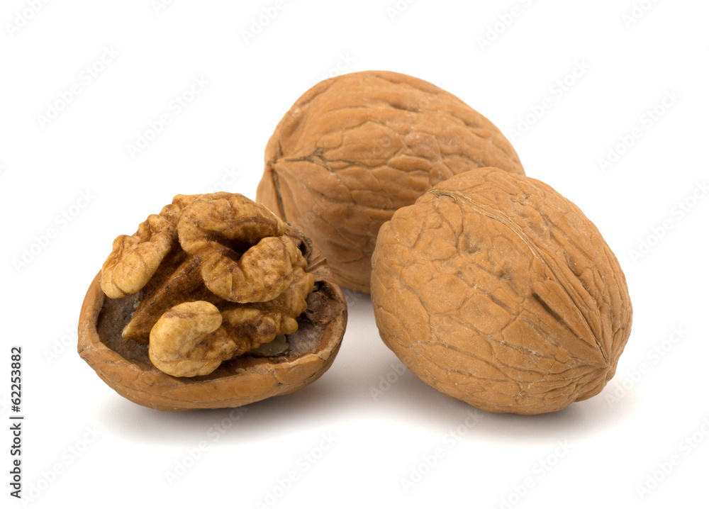whole and cracked walnut isolated on the white background whole and cracked walnut isolated on the white background