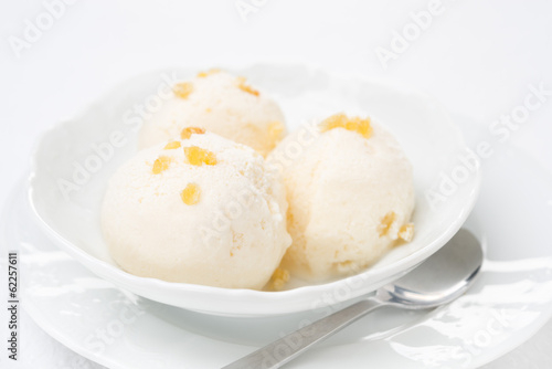 Close-up of ginger ice cream with melted milk in a bowl