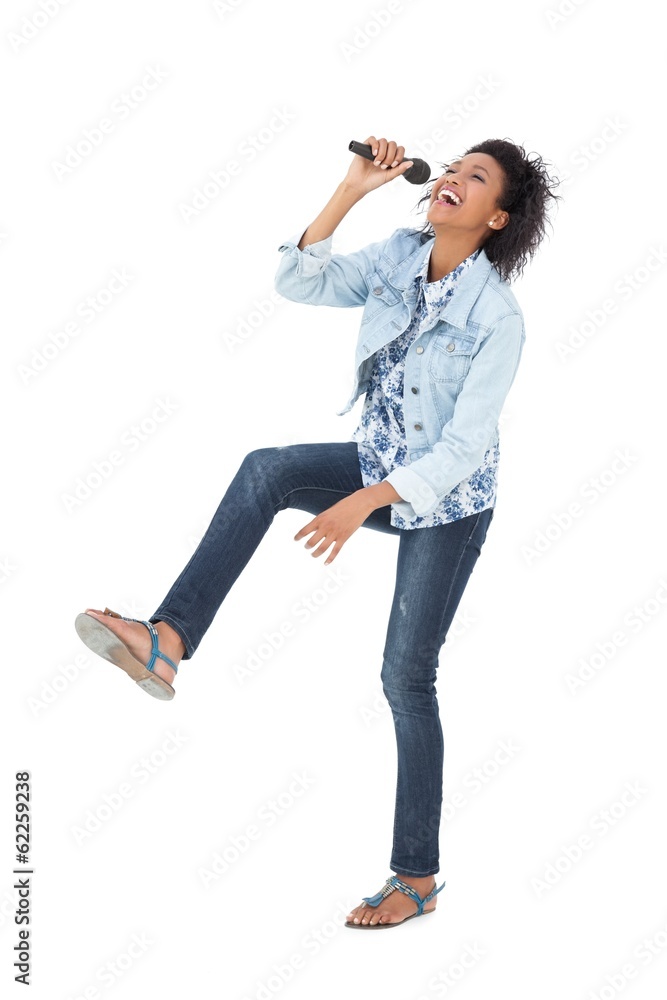 Full length of a woman singing into a microphone Full length of a woman singing into a microphone