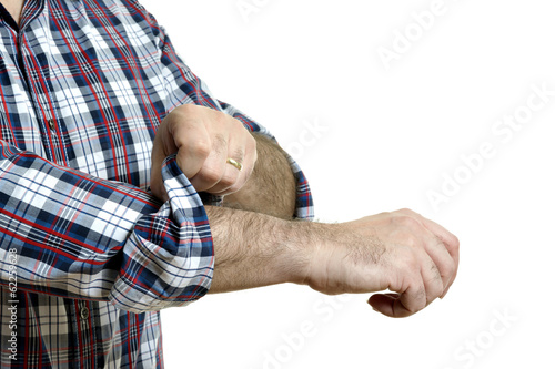 Man rolls up sleeves