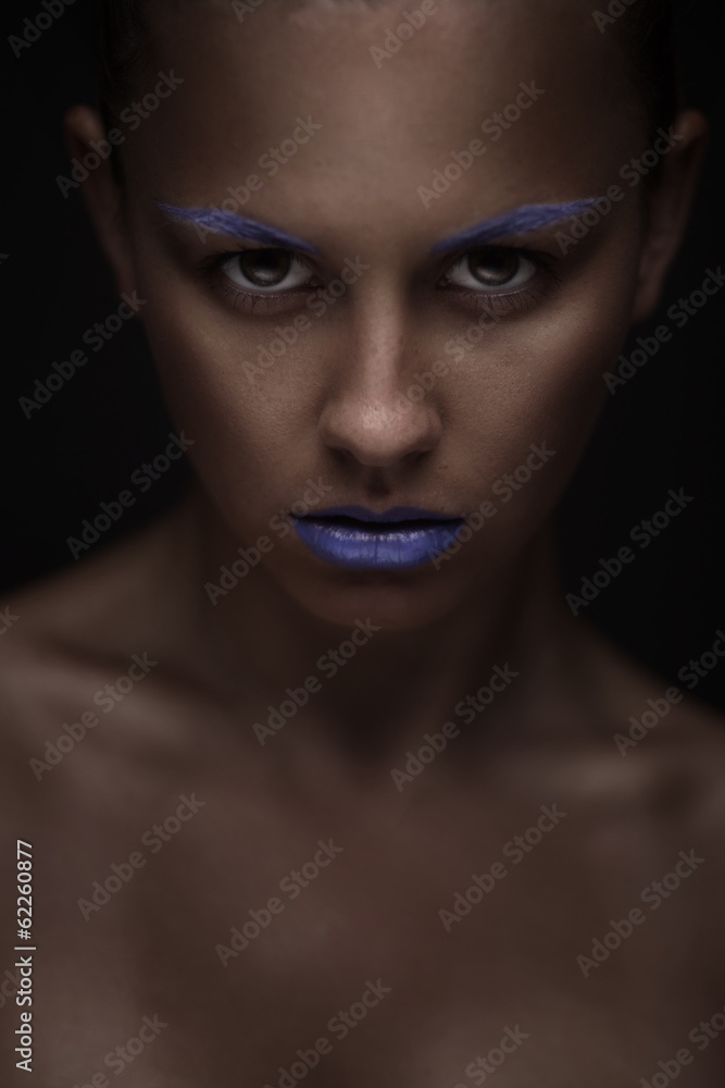 portrait of beautiful woman with creative makeup
