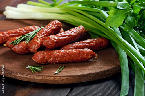 Smoked sausages on table