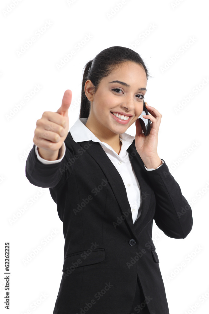 Arab business woman calling on the phone and thumb up Arab business woman calling on the phone and thumb up
