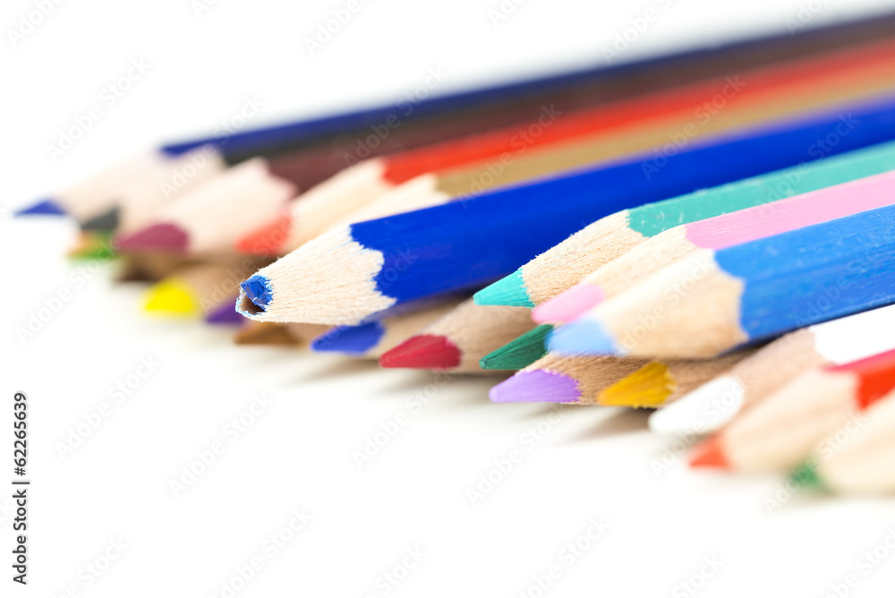 Colored pencil crayons with focus to a broken one Colored pencil crayons with focus to a broken one