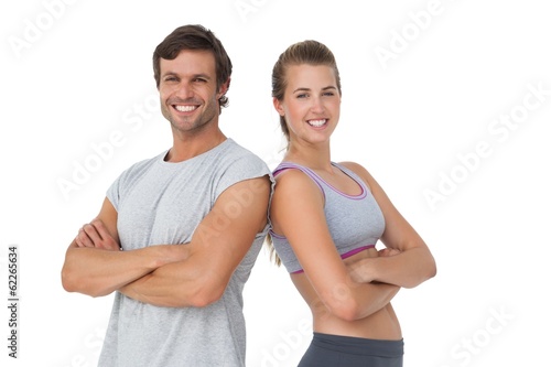 Portrait of a sporty young couple with arms crossed © WavebreakMediaMicro
