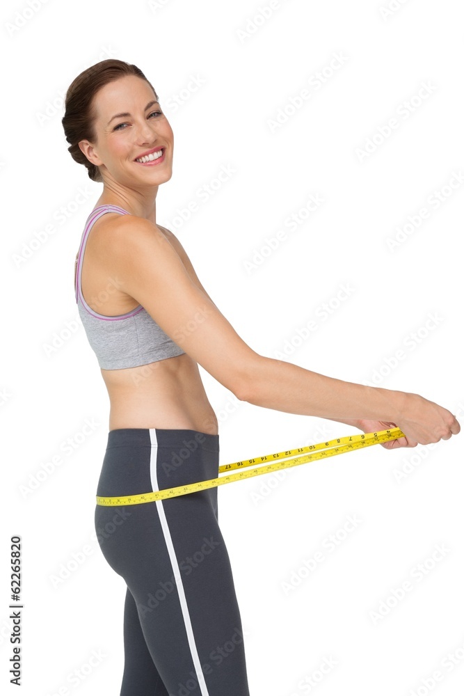 Portrait of a fit woman measuring buttocks Portrait of a fit woman measuring buttocks