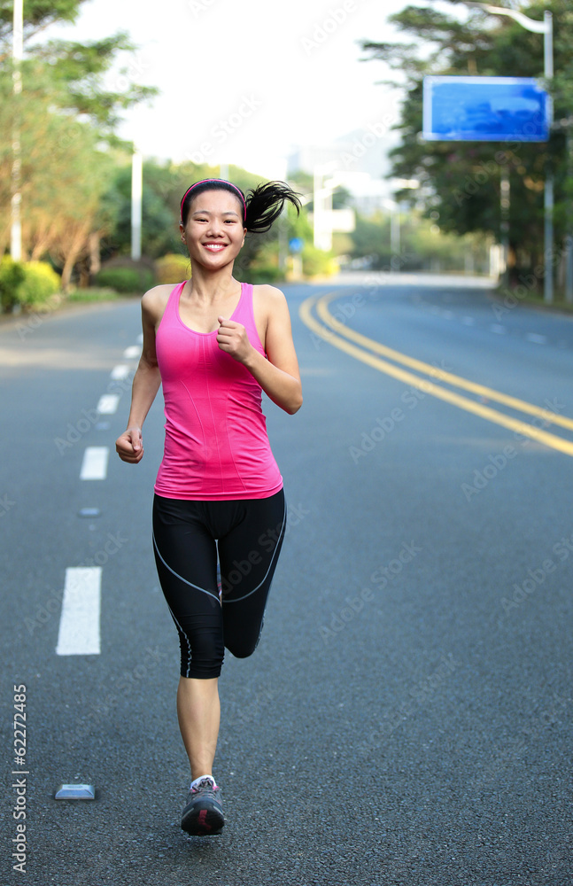 fitness woman runner running on road