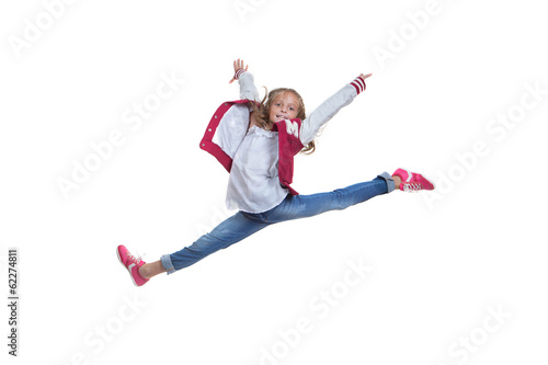 fit healthy young girl doing ballet leap