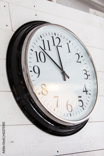 wall clock on old wooden background