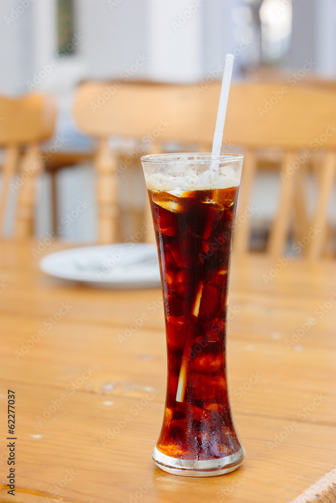 Espresso Ice cube on wood table Espresso Ice cube on wood table