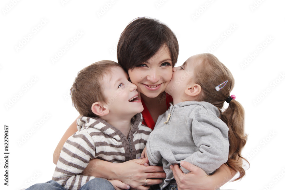 Mother hugging two children over white