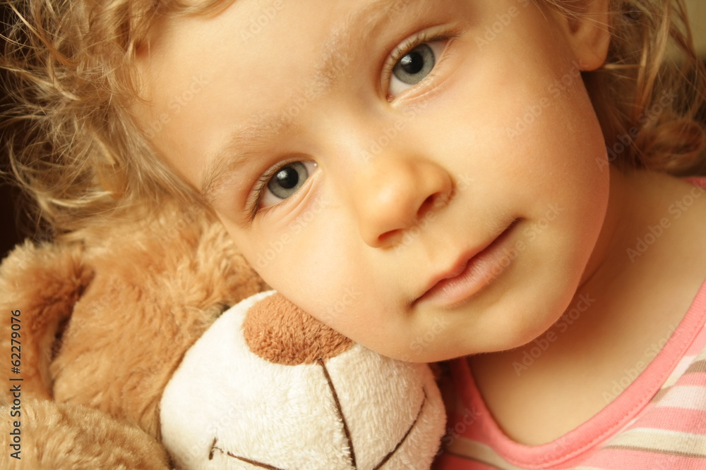 Embracing a teddy bear Embracing a teddy bear