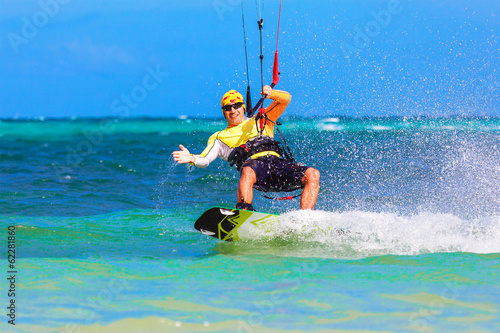 young smiing  kitesurfer on sea background Extreme Sport Kitesur