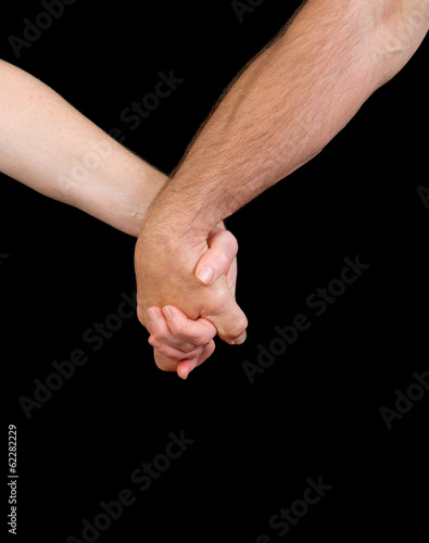 older couple holding hand isolated over black