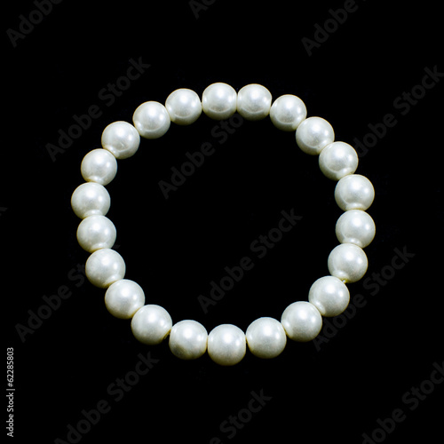 White Pearl bracelet on black background