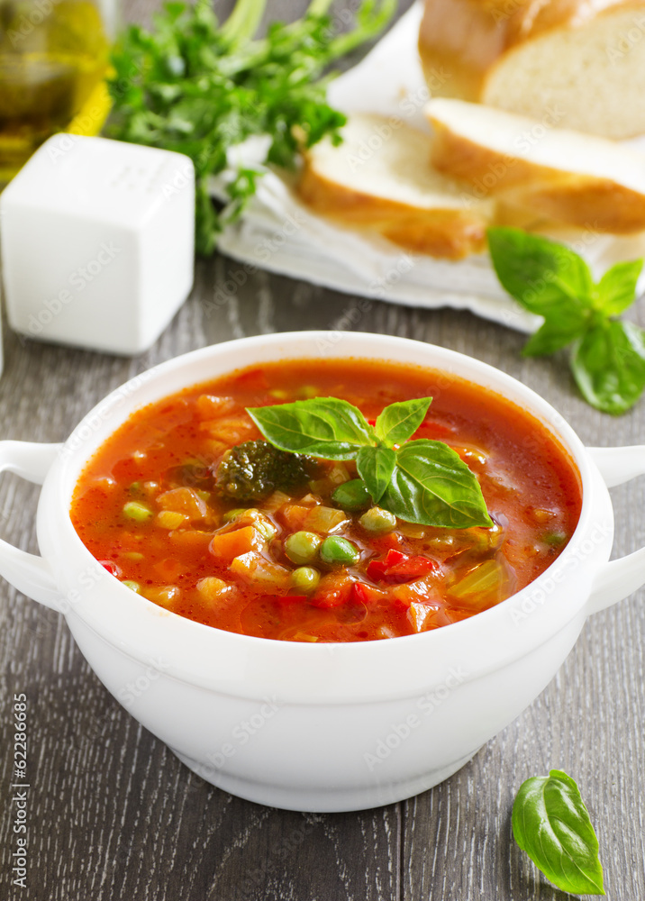 Bowl of minestrone soup with bread Bowl of minestrone soup with bread