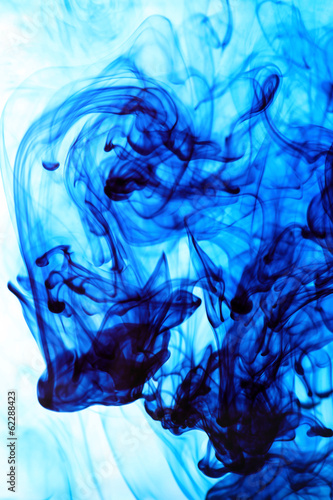 Ink in water on blue background