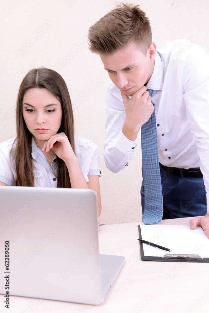 Successful young businesspeople working at office Successful young businesspeople working at office