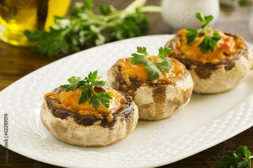 Mushrooms baked with cheddar cheese.