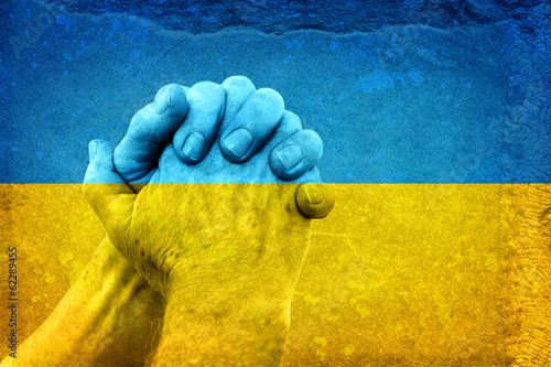 Fotobehang Hands on Ukrainian Flag