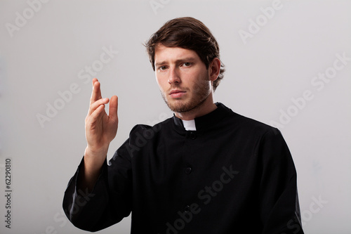 Priest is giving a blessing