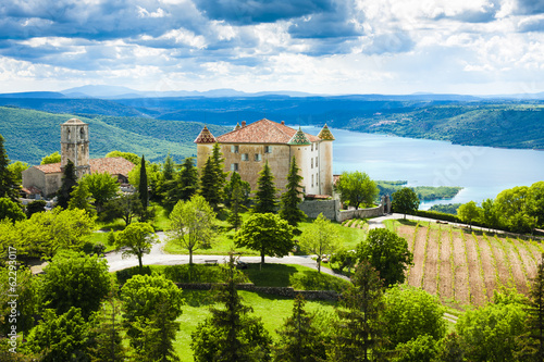 chateau and church in Aiguines and St Croix Lake at background,