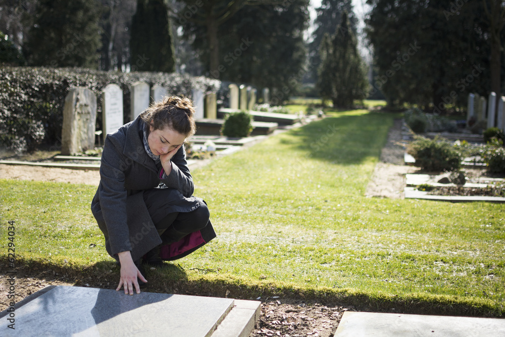 widow at grave of deceased husband widow at grave of deceased husband